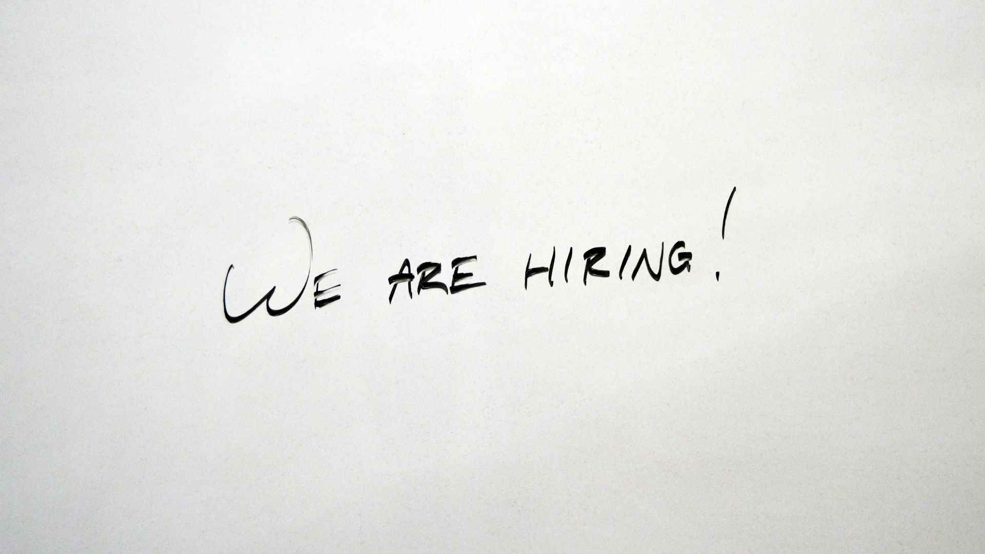 Black writing on a white background saying “we are hiring”, which can be done with these paid job portals