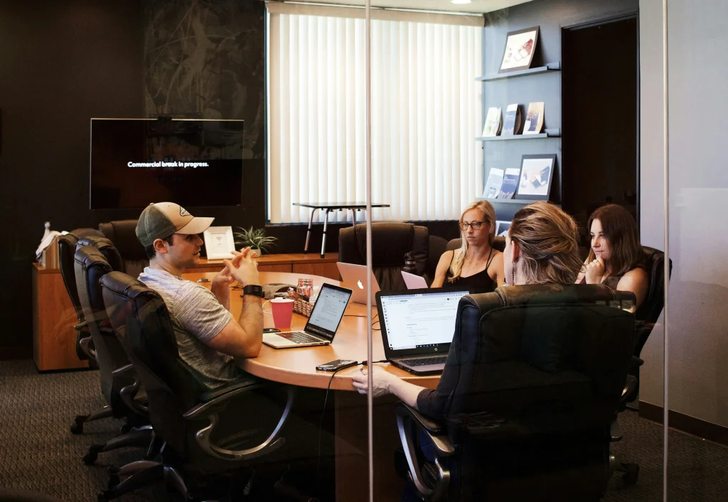 HR team discussing pay transparency compliance in a meeting room ahead of the EU Pay Transparency Directive.